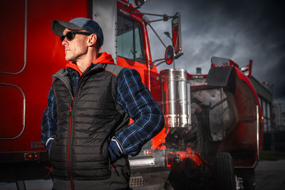 Rear view of man standing in factory