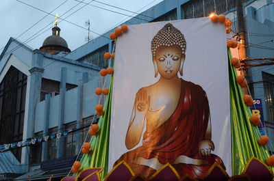 Low angle view of statue against building