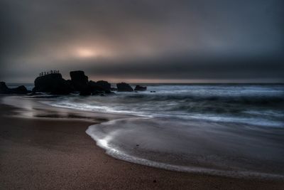 Scenic view of beach against sky