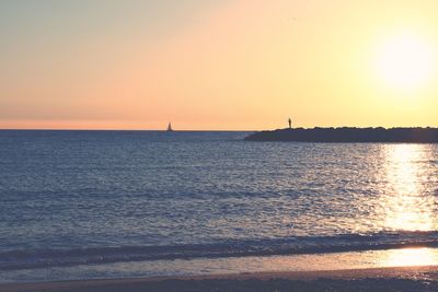 Scenic view of sea at sunset