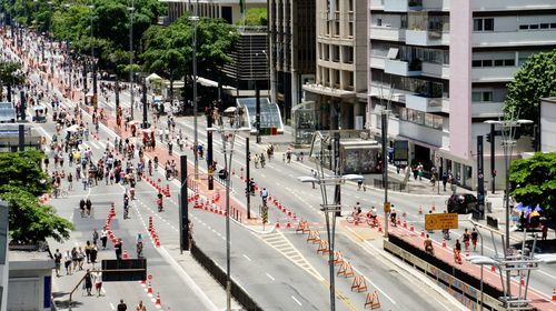 High angle view of vehicles on road along buildings