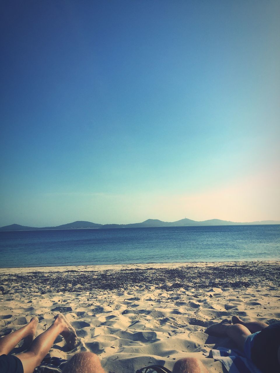 beach, sand, sea, blue, tranquility, scenics, nature, clear sky, tranquil scene, beauty in nature, horizon over water, water, sky, outdoors, shore, no people, vacations, day