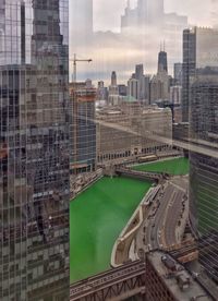 High angle view of river amidst buildings in city