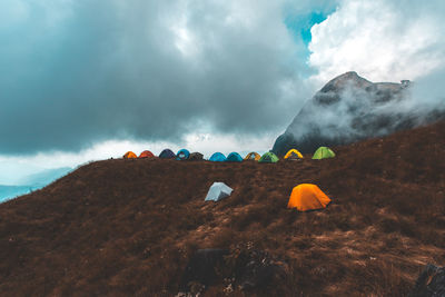 Panoramic view of landscape against cloudy sky