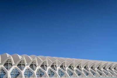 Low angle view of built structure against clear blue sky