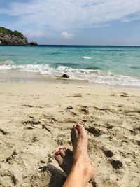 Low section of legs on beach