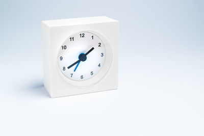 Close-up of clock against white background