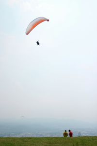 Hot air balloons flying over landscape