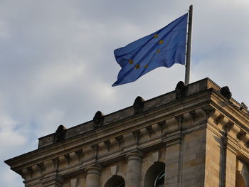 Low angle view of flag against sky