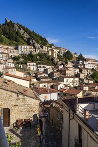 High angle view of townscape against blue sky