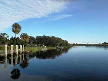 Scenic view of lake against clear blue sky