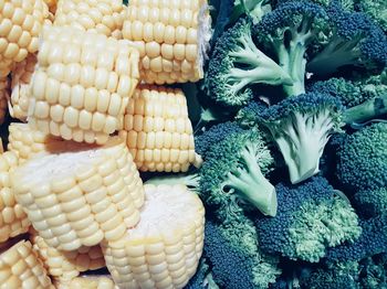 High angle view of broccoli and corns for sale