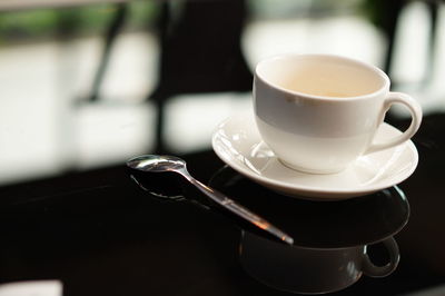 Close-up of coffee cup on table