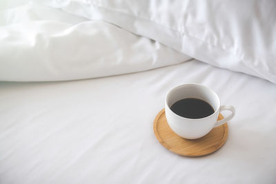 High angle view of coffee on bed