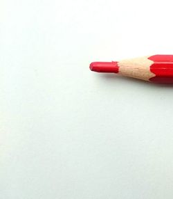 Close-up of red balloon over white background