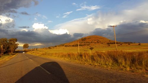 Country road passing through field