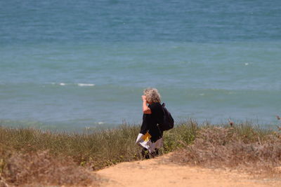 Full length of woman on beach