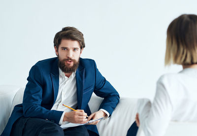 Young man sitting at home