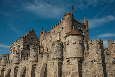 Stone wall and tower at the gravensteen castle in ghent. a city with gothic buildings in belgium.