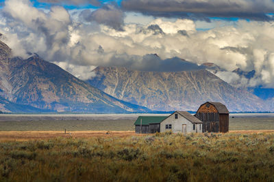 Scenic view of landscape and mountains against sky