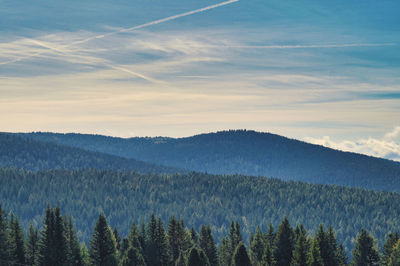 Scenic view of mountains against sky at sunset