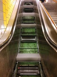 Low angle view of steps at railroad station at night