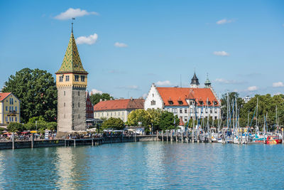 Panoramic view of buildings in city against sky