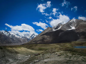 Scenic view of snowcapped mountains against sky