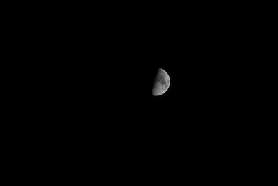 Low angle view of moon against sky at night