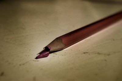 Close-up of pen on table