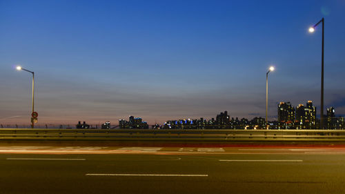 Illuminated street lights at night