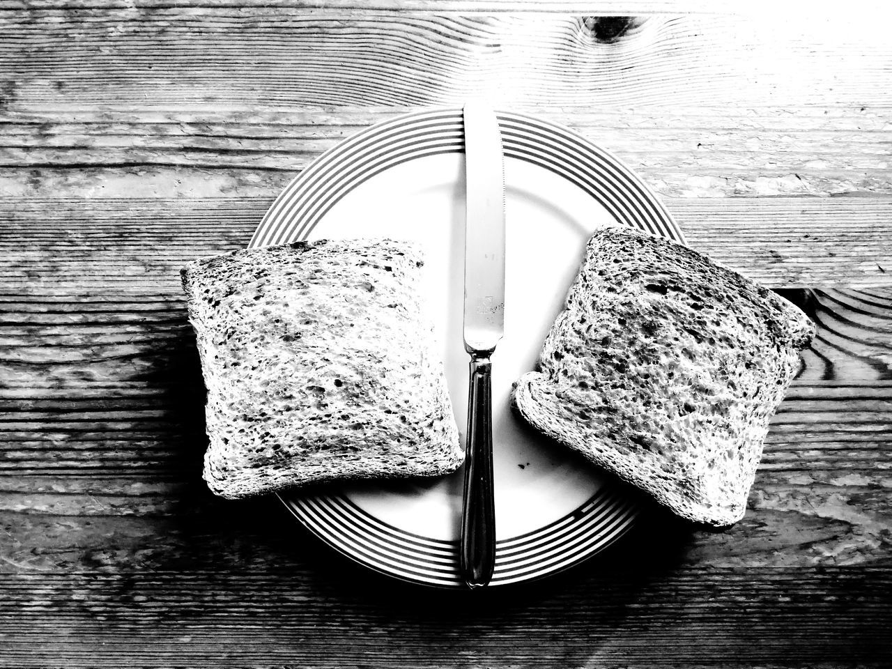 table, wood - material, still life, bread, no people, close-up, food and drink, fork, directly above, indoors, eating utensil, food, high angle view, kitchen utensil, metal, day, plate, freshness, water, brown bread, table knife