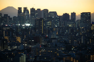 Illuminated buildings in city at night