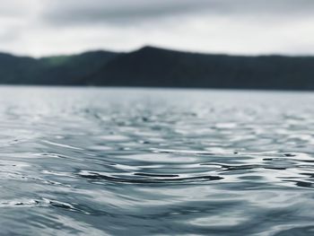 Close-up of rippled water against sky