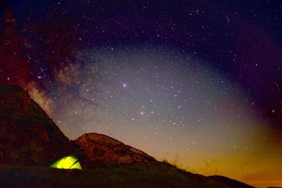 Low angle view of mountain against sky at night