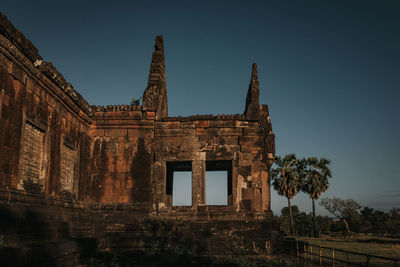 Low angle view of old building against clear sky