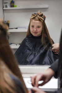 Girl having her hair cut