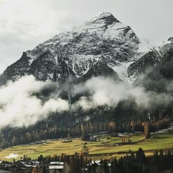 Scenic view of snowcapped mountains against sky