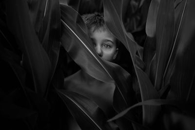 Close-up portrait of girl with plants