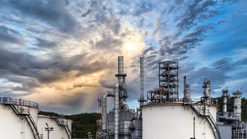 Oil and gas refinery plant and storage tank form industry zone with blu sky background, oil and gas