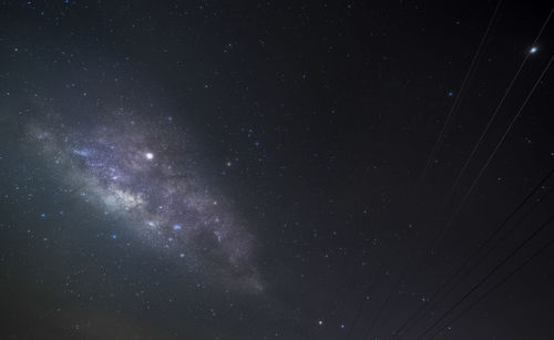 Low angle view of stars in sky at night