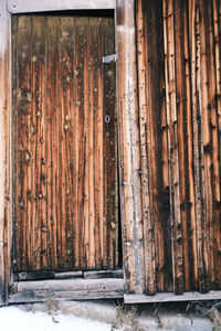 Close-up of old wooden door of building