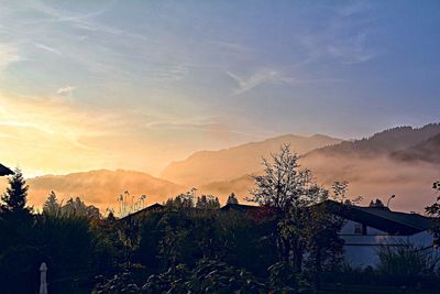 Scenic view of mountains against sky at sunset