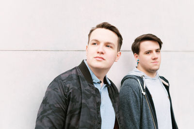 Portrait of young couple standing outdoors