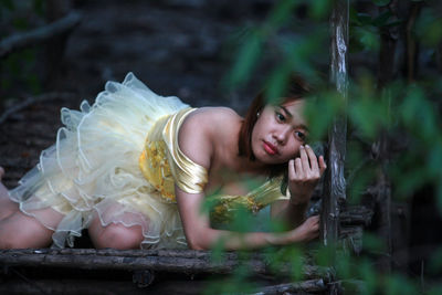 Young woman posing in dress outdoors