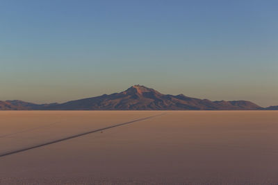 Scenic view of desert against clear sky