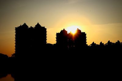 Silhouette of building at sunset