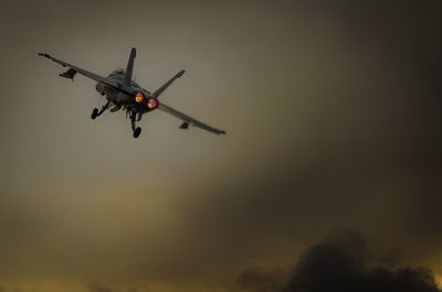 Low angle view of airplane flying in sky