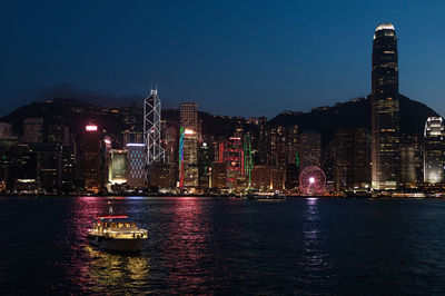 Illuminated buildings in city at night