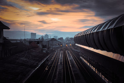 High angle view of railroad tracks against sky during sunset